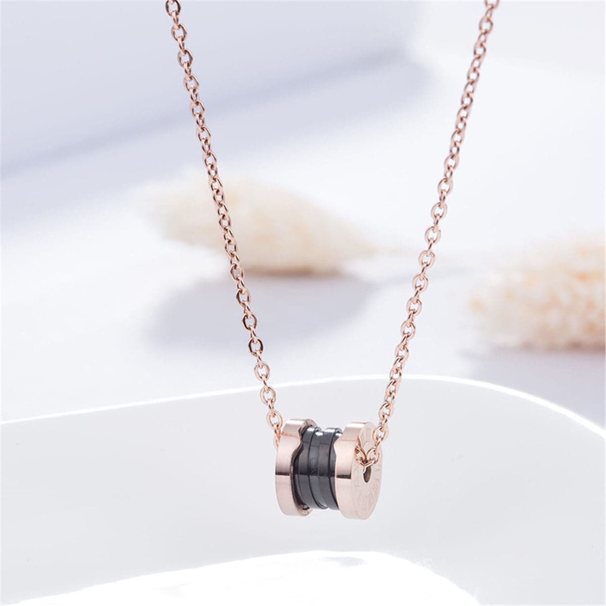 Black Acrylic & Rose Goldtone Coil Pendant Necklace