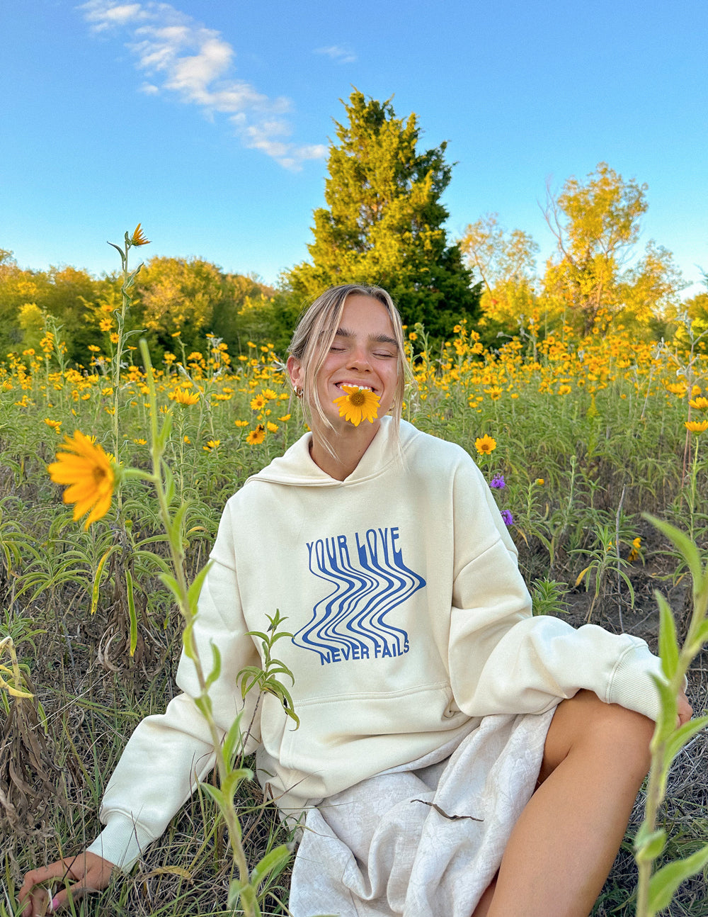 Elevated Faith Love Never Fails Cream Unisex Hoodie