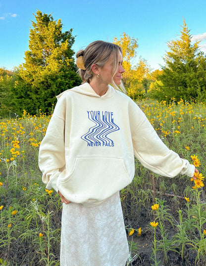Elevated Faith Love Never Fails Cream Unisex Hoodie