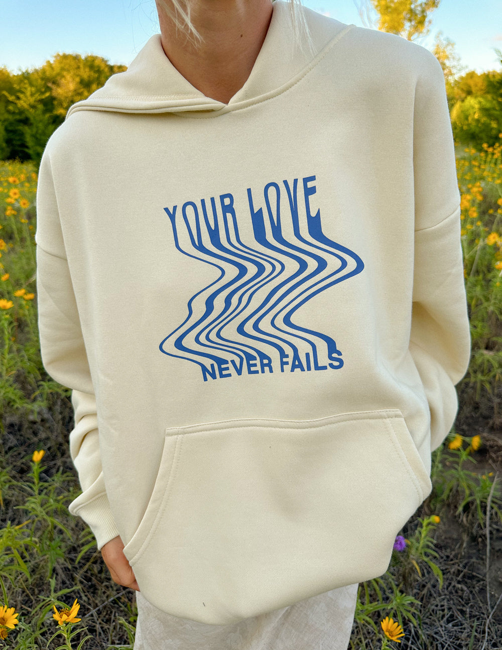 Elevated Faith Love Never Fails Cream Unisex Hoodie