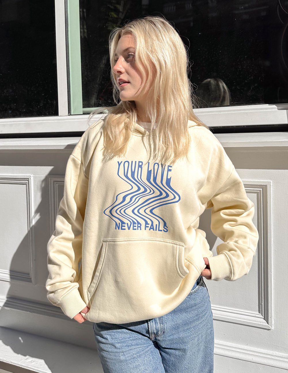 Elevated Faith Love Never Fails Cream Unisex Hoodie