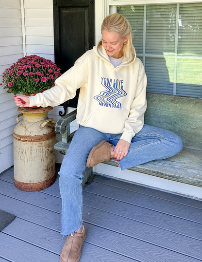 Elevated Faith Love Never Fails Cream Unisex Hoodie