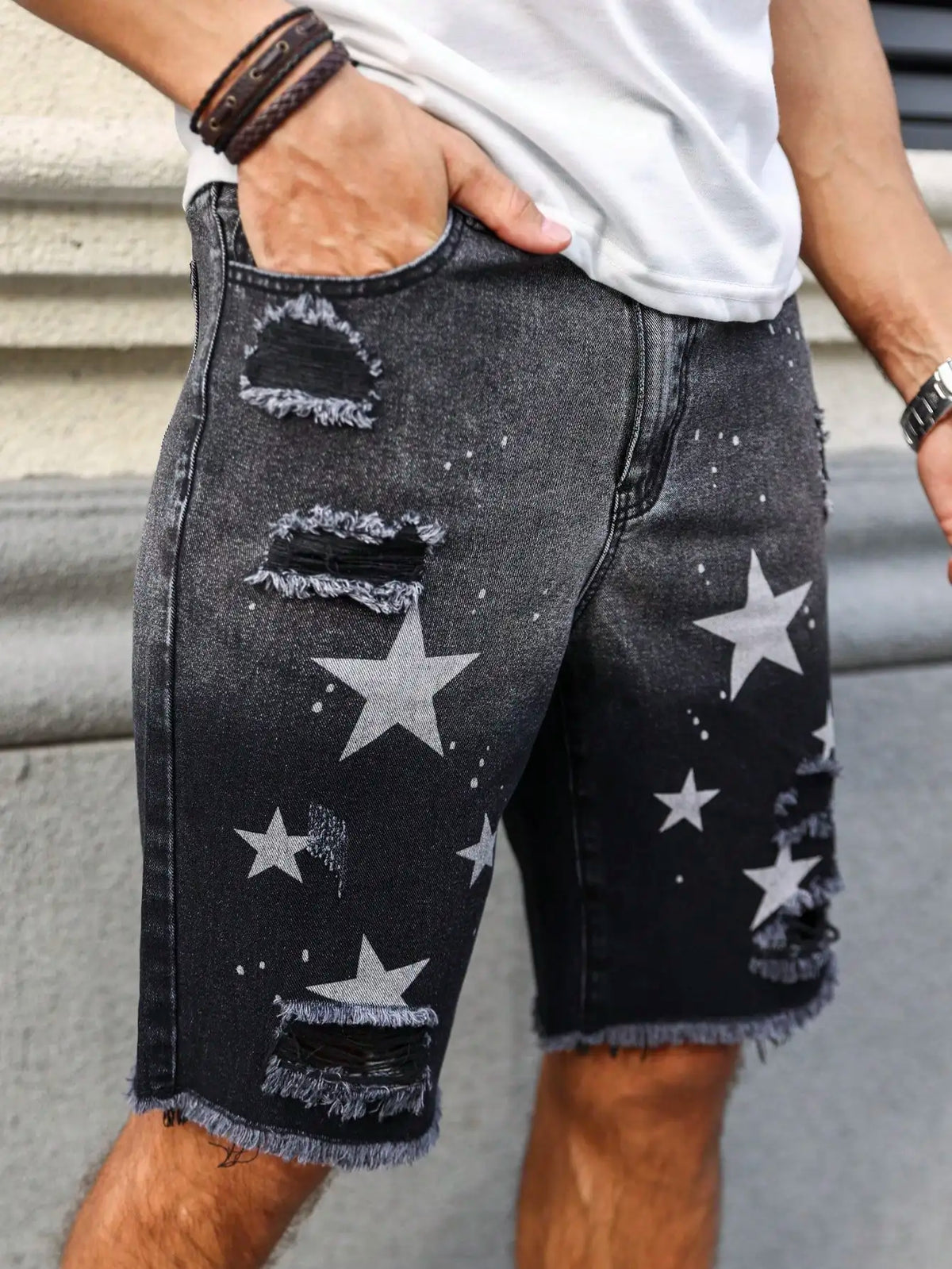 Men's summer denim printed shorts. Black - grey gradient color. Ripped details. Street - style trend.