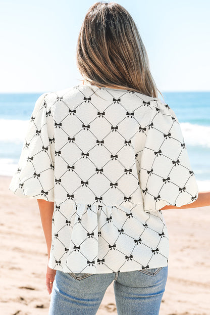 Threaded Pear Ezra Bowknot Print Front Knots Bubble Sleeve Blouse