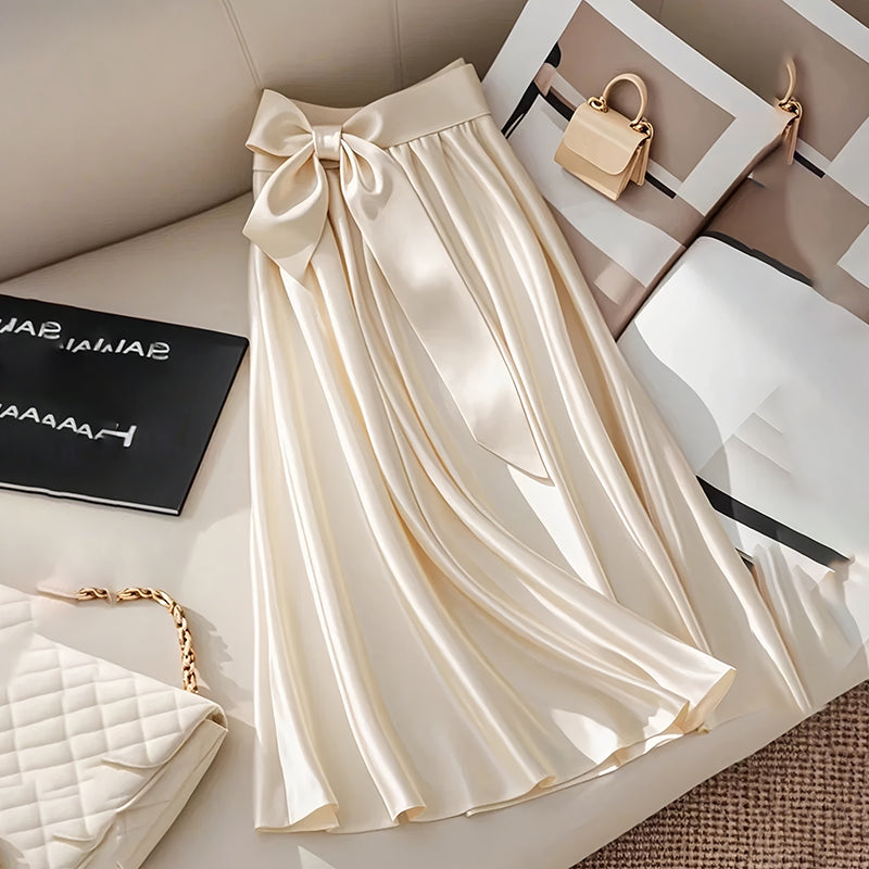 Women’s Solid Color Satin Midi Skirt with Bow Detail | Elegant Pleated Satin Skirt | High-Waisted A-Line Vacation Skirt | Chic Silk-Like Office Midi Skirt | 2026 Modern Luxury Skirt Collection