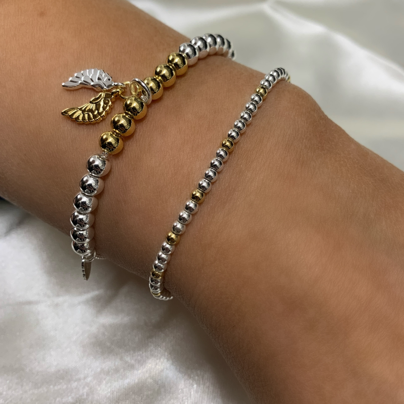Estella Bartlett Angel Wings Bracelet Set of 2 Silver and Gold Beaded bracelets